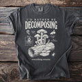 Dark grey t-shirt with "I'd Rather Be Decomposing" text and mushroom illustration.