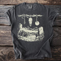 Dark gray t-shirt with cream linework of wolves, rocks, moon, stars, and a skull hanging from a branch.