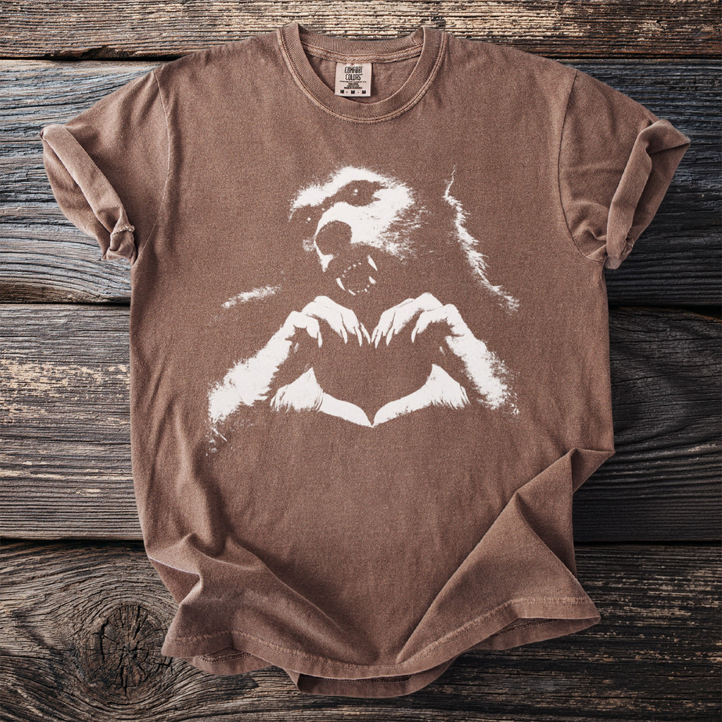 Brown t-shirt with white werewolf and heart hands graphic.