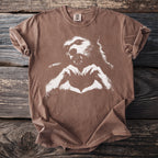 Brown t-shirt with white werewolf and heart hands graphic.