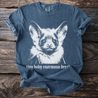 Blue t-shirt with white graphic of a bat and text "tiny body enormous dreams".