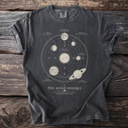 Dark grey t-shirt printed with The Seven Spheres celestial mechanics diagram.
