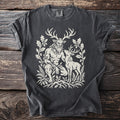 Dark gray t-shirt with a cream graphic of a horned man and a deer amidst foliage.