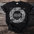 Black t-shirt with nature illustrations of insects and text "Love The Unloved Specimens Of Curiosity".