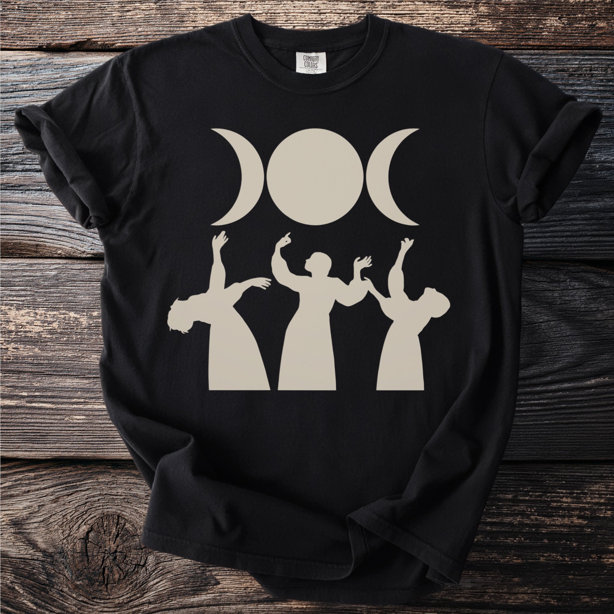 Black t-shirt with a triple moon design and three figures reaching up.