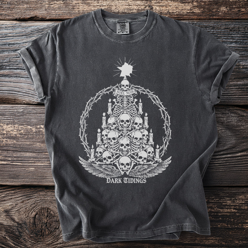 Dark grey t-shirt with white graphic of a skeleton tree, skulls, candles, and "DARK TIDINGS".