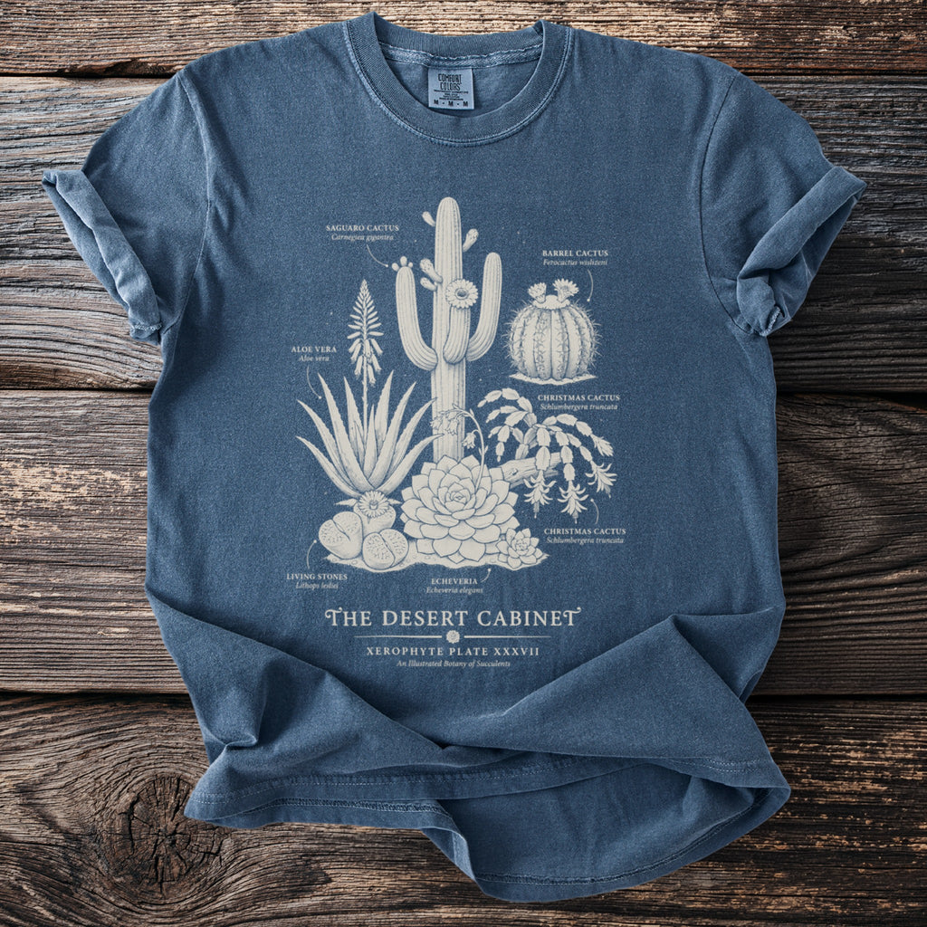Blue t-shirt with "The Desert Cabinet" illustration of various labeled succulents.