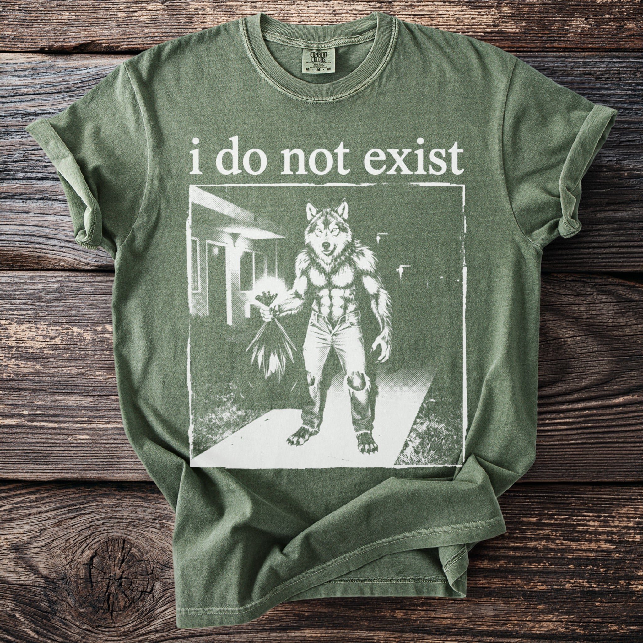 Green t-shirt with "i do not exist" text and werewolf graphic holding flowers.