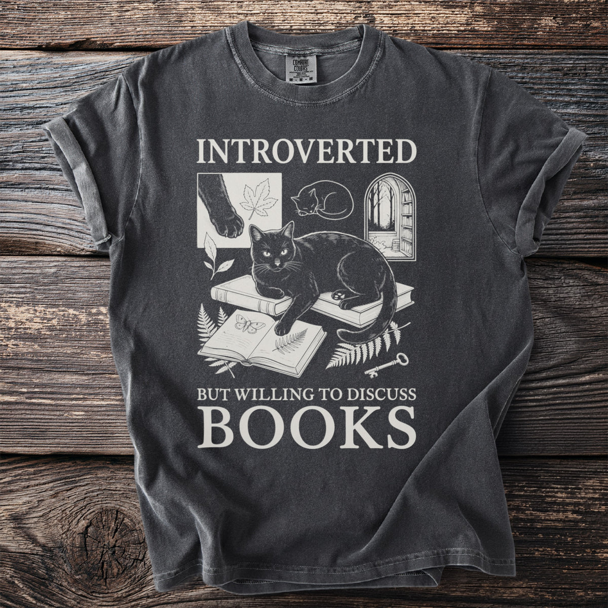 Dark grey t-shirt with "INTROVERTED BUT WILLING TO DISCUSS BOOKS" and cat art.