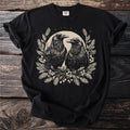 Black t-shirt with two ravens surrounded by foliage and a subtle moon.