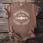 Brown shirt with white Moon Phases, lunar cycle, witchy celestial graphic.