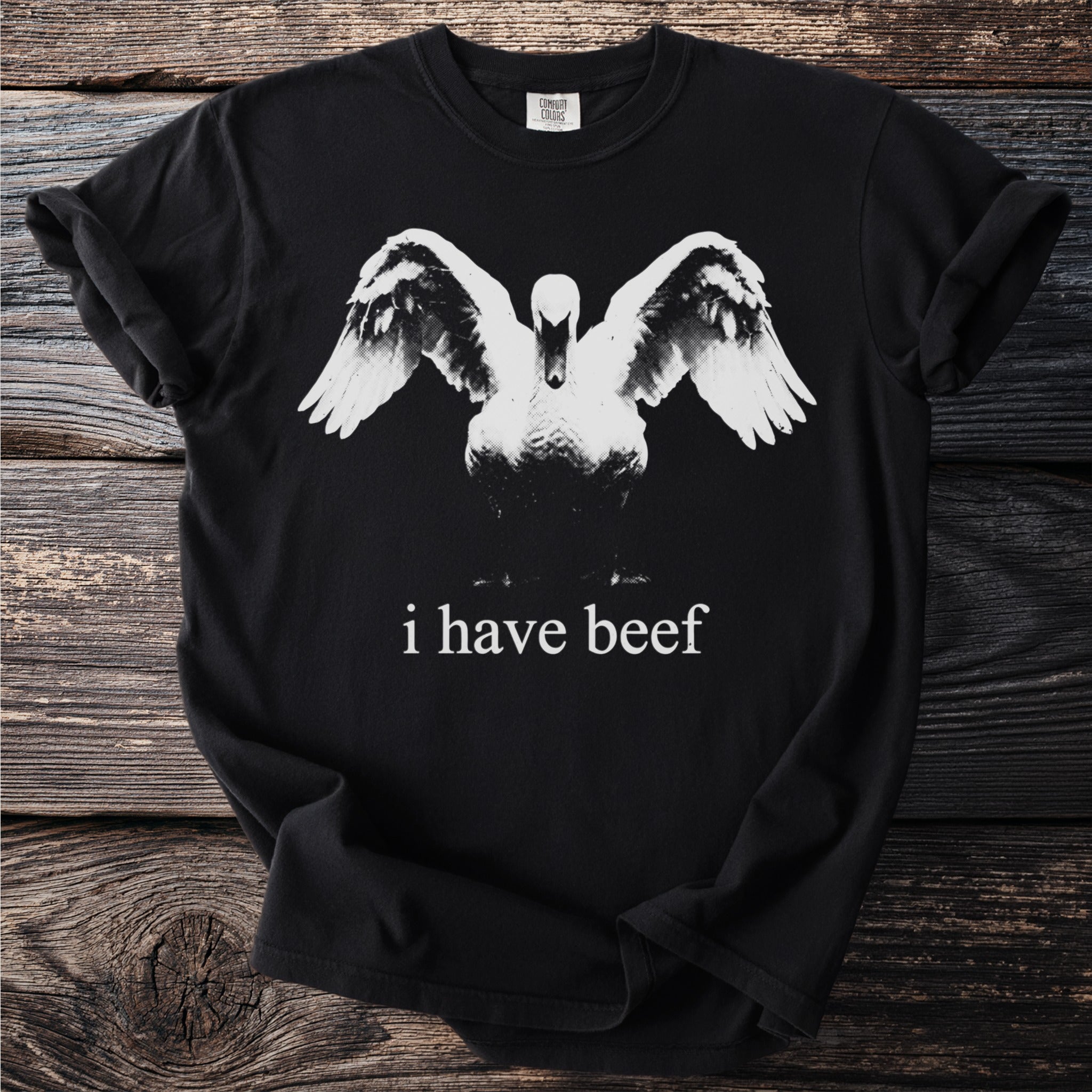 Black t-shirt with swan graphic and "i have beef" text.