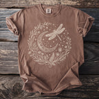 Brown t-shirt featuring a cream whimsical dragonfly and crescent moon design.