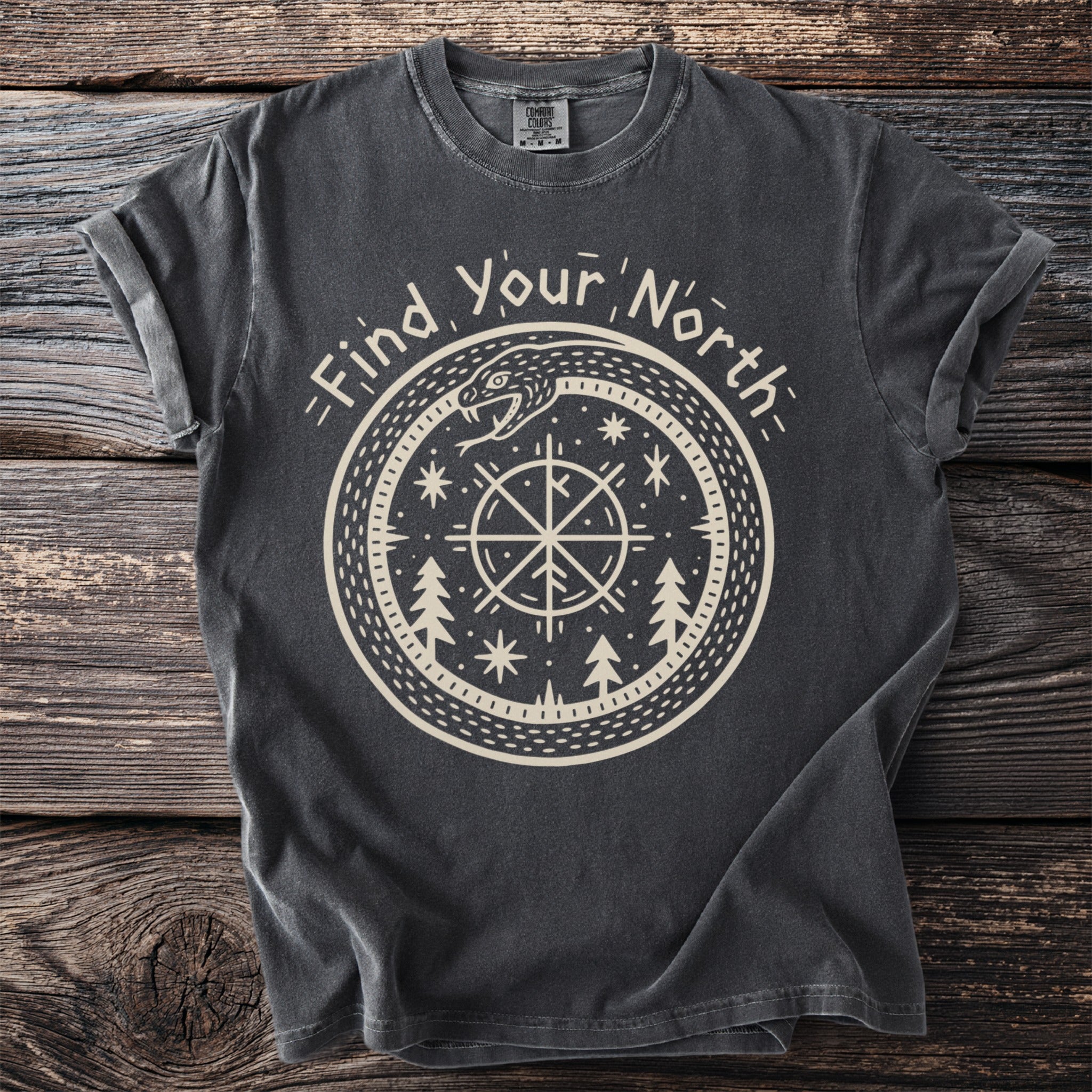 Dark grey t-shirt with "Find Your North" circular design featuring compass, snake, and trees.