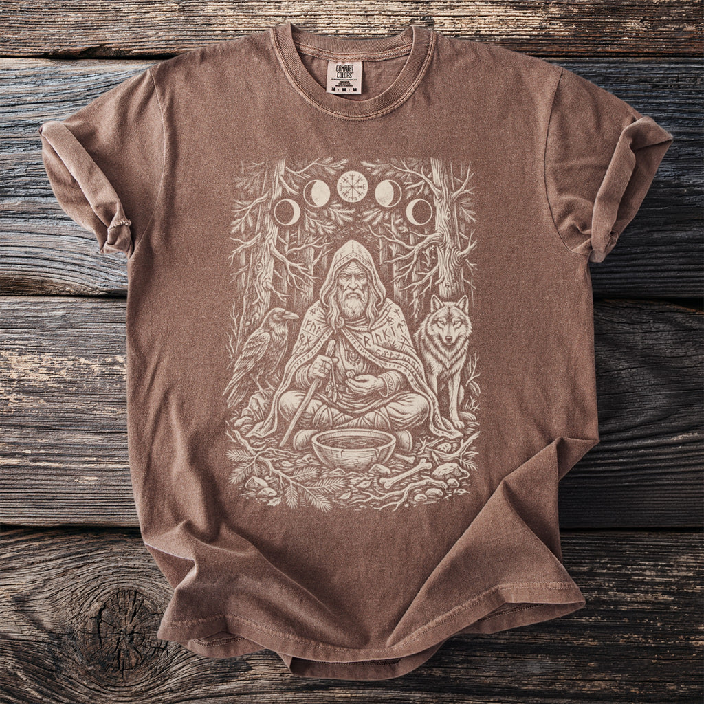 Brown t-shirt with a distressed print of a shaman, wolf, raven, and moon phases.
