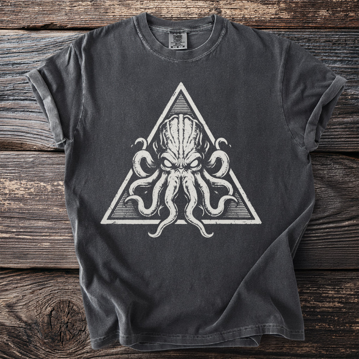 Dark gray t-shirt with a white triangle graphic of a creature's head with tentacles.