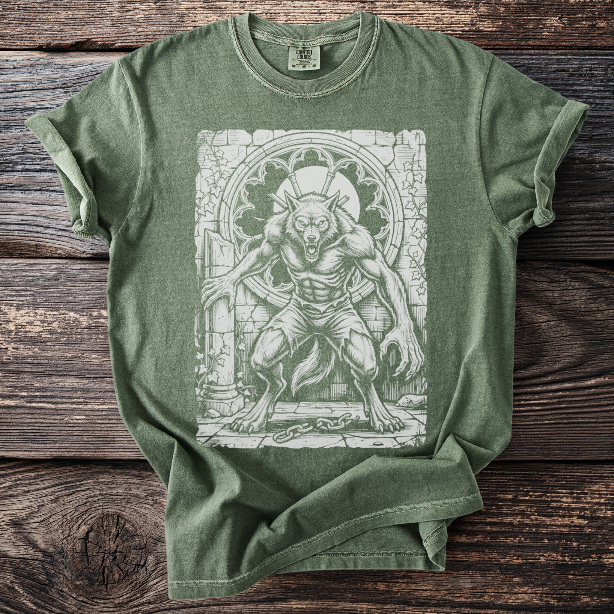 Green t-shirt with a distressed print of a werewolf in a gothic setting.