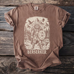 Brown t-shirt with a graphic of a bear-man, wolf, and Viking shield.