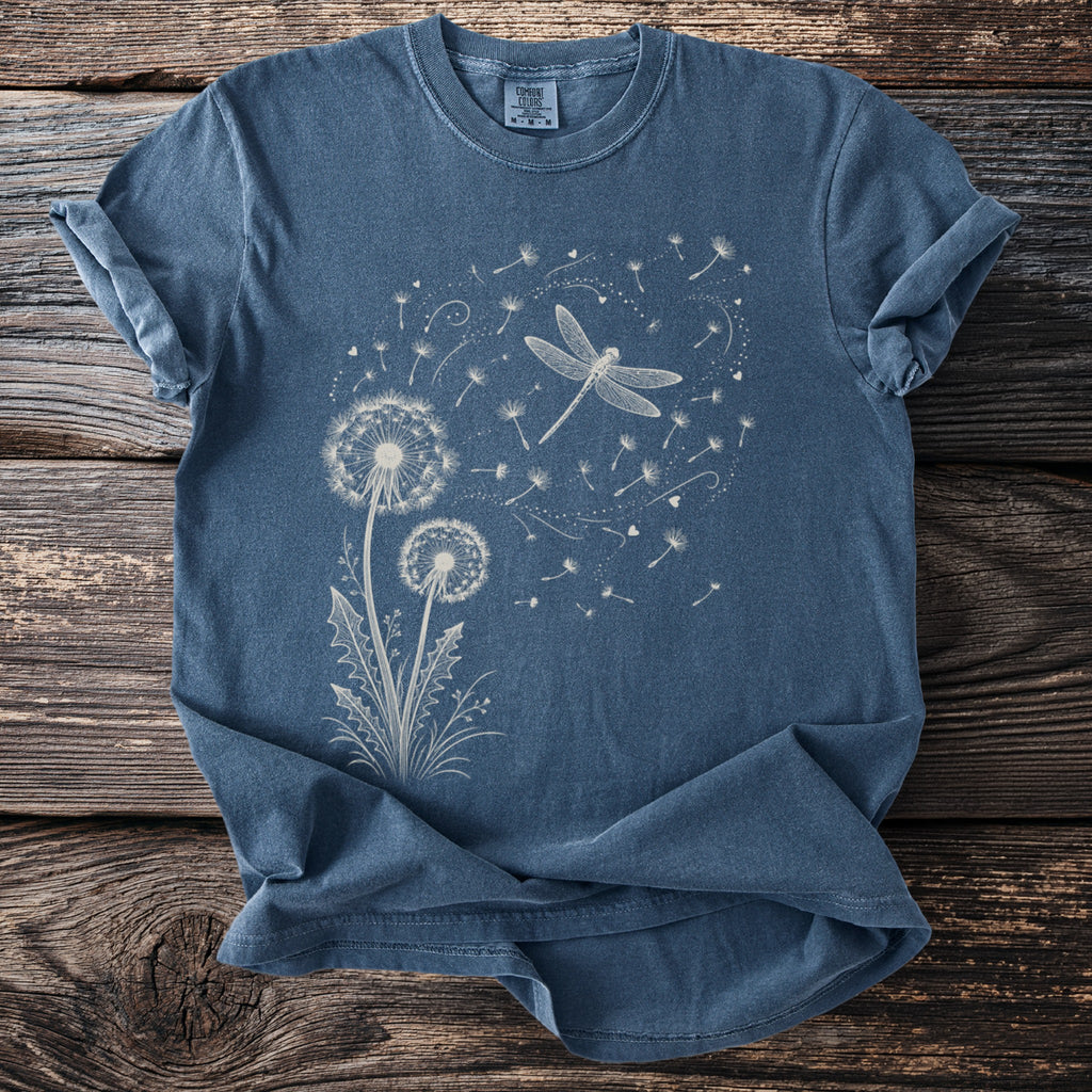 Blue t-shirt with white dandelion and dragonfly graphic.