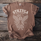 Brown t-shirt with white Strzyga Slavic owl demon folklore graphic design.