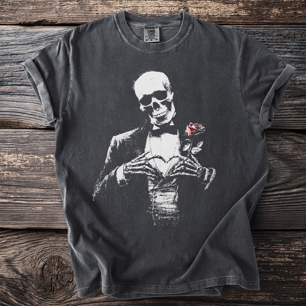 Dark gray t-shirt with skeleton in tuxedo holding a rose and forming heart shape.
