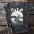 T-shirt with "The Bats" text and a graphic of bats flying over a city skyline.