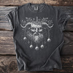 Dark t-shirt with a white illustration of Krampus with horns, beard, and hanging ornaments.