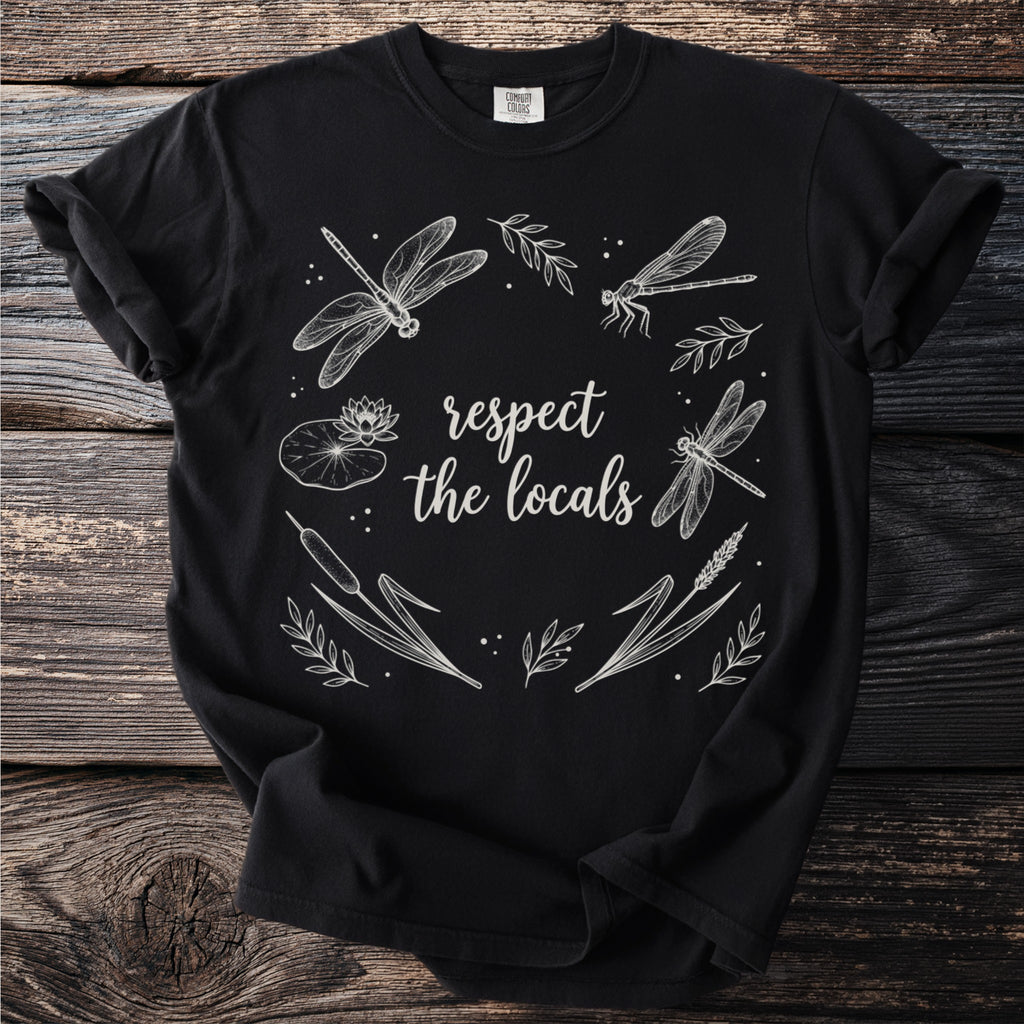 Black t-shirt with "respect the locals" and white dragonfly, lily pad, and cattail illustration.