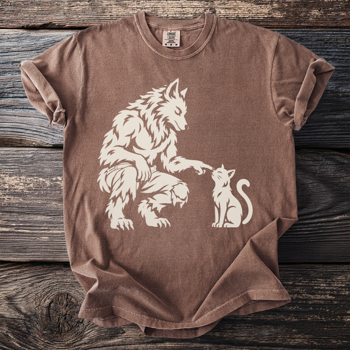 Werewolf gently touching nose of white cat on brown t-shirt.