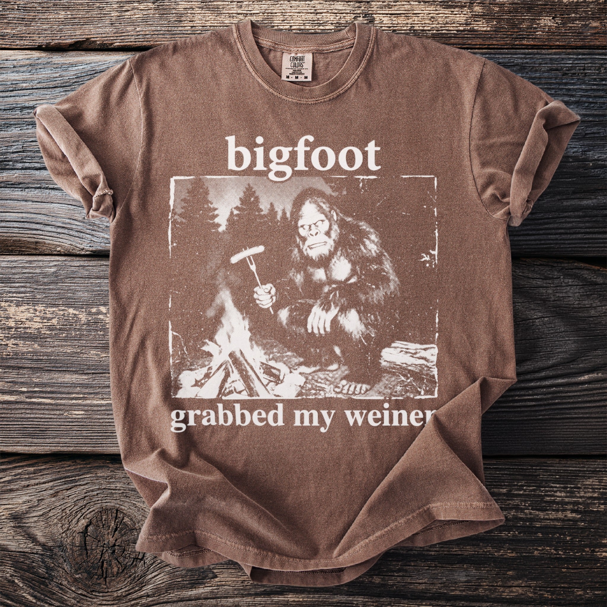 Brown t-shirt with Bigfoot graphic and text "bigfoot grabbed my weiner".