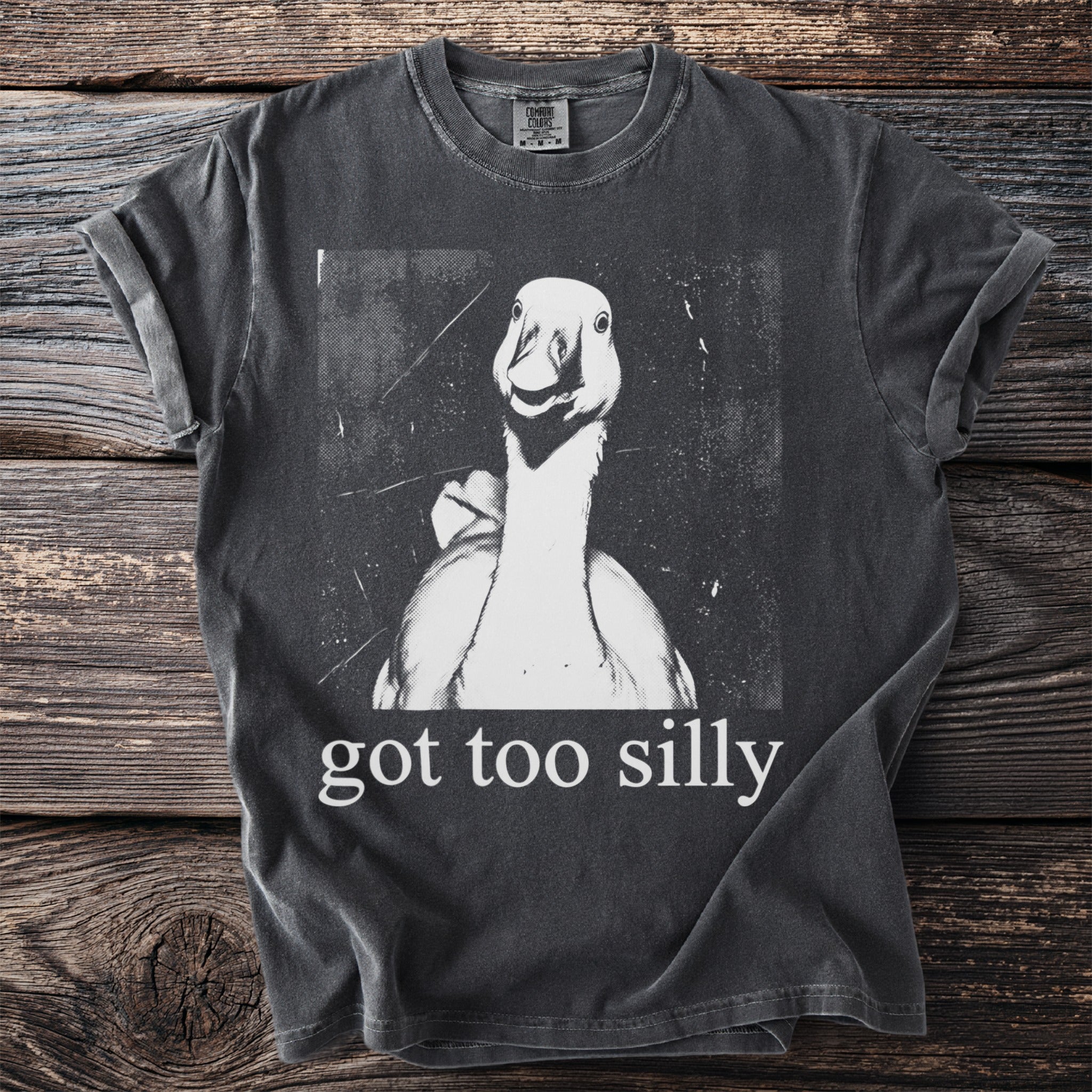 Dark gray t-shirt with a distressed graphic of a goose and text reading "got too silly".