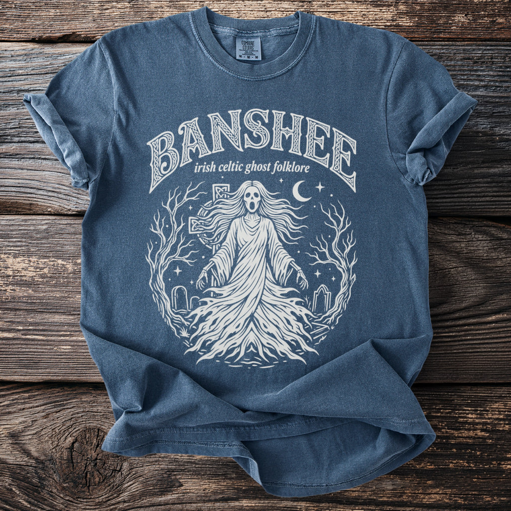 Blue t-shirt with a white graphic of a banshee and text "Banshee irish celtic folklore".