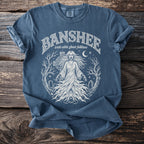 Blue t-shirt with a white graphic of a banshee and text "Banshee irish celtic folklore".