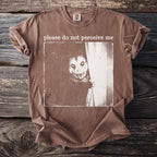 Brown t-shirt with a graphic of an opossum behind a curtain and text "please do not perceive me".