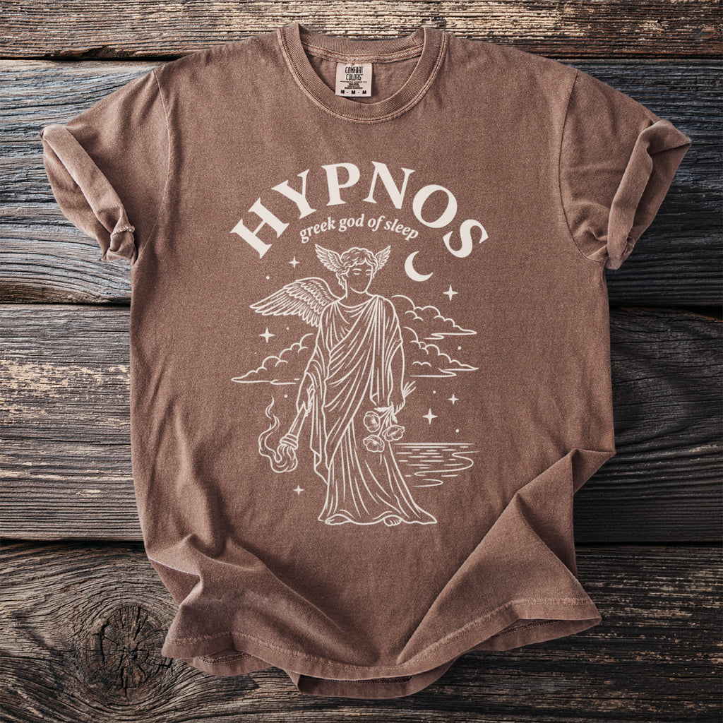 Brown t-shirt featuring "Hypnos greek god of sleep" graphic with winged figure and moon.