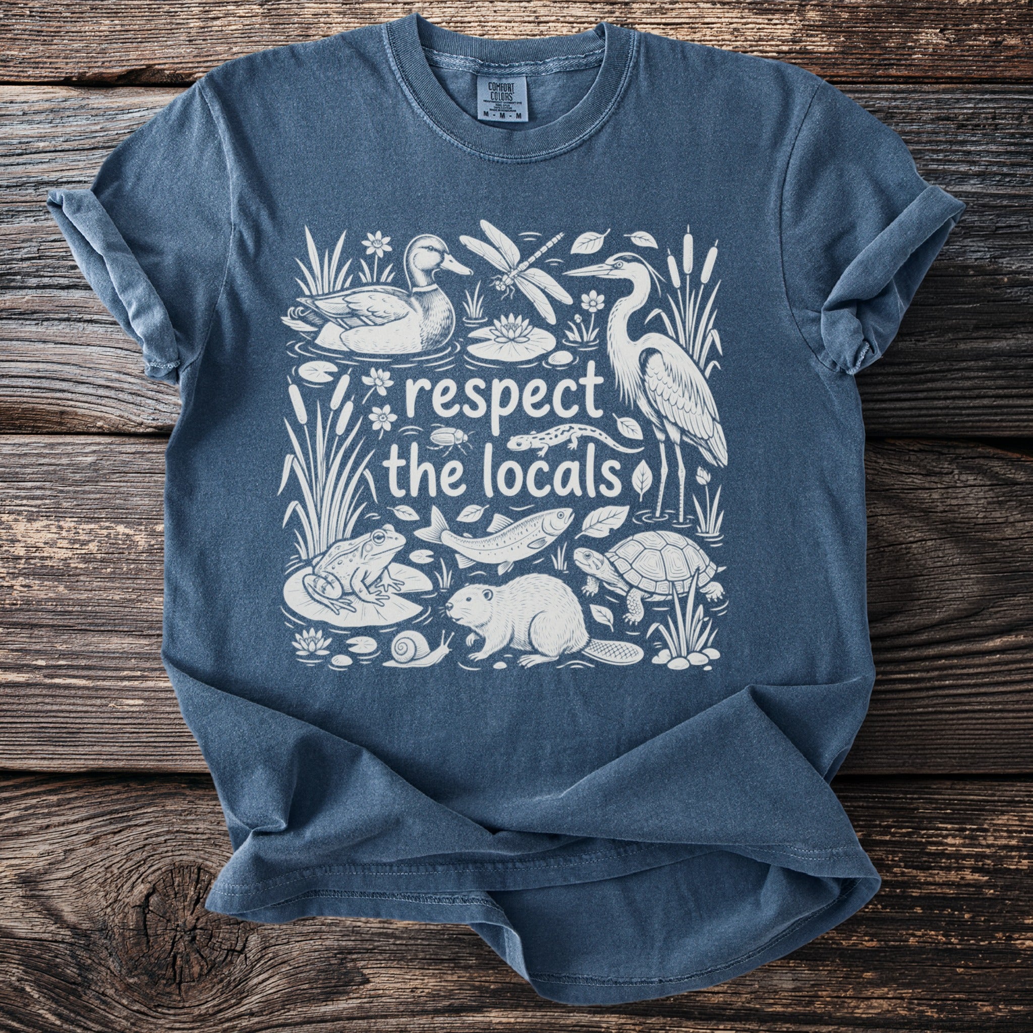 Blue t-shirt with "respect the locals" and woodland creatures in white.
