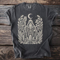 Dark gray t-shirt showing a Celtic druid with an owl, oak wreath, standing stones, and mushrooms.