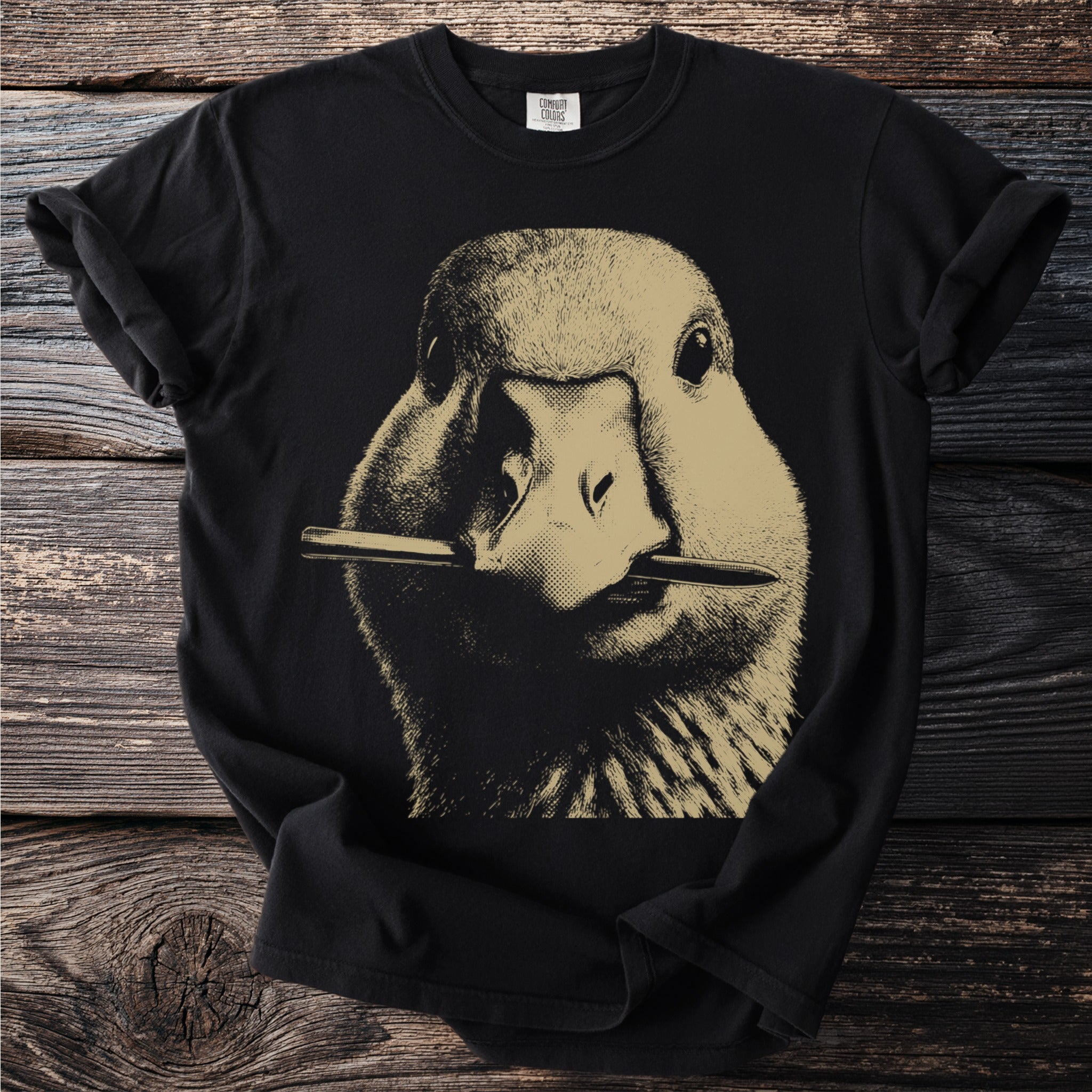 Black t-shirt with front graphic of a duck holding a pencil in its beak.