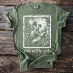 Olive green t-shirt with "girls will be girls" text and vintage illustration.