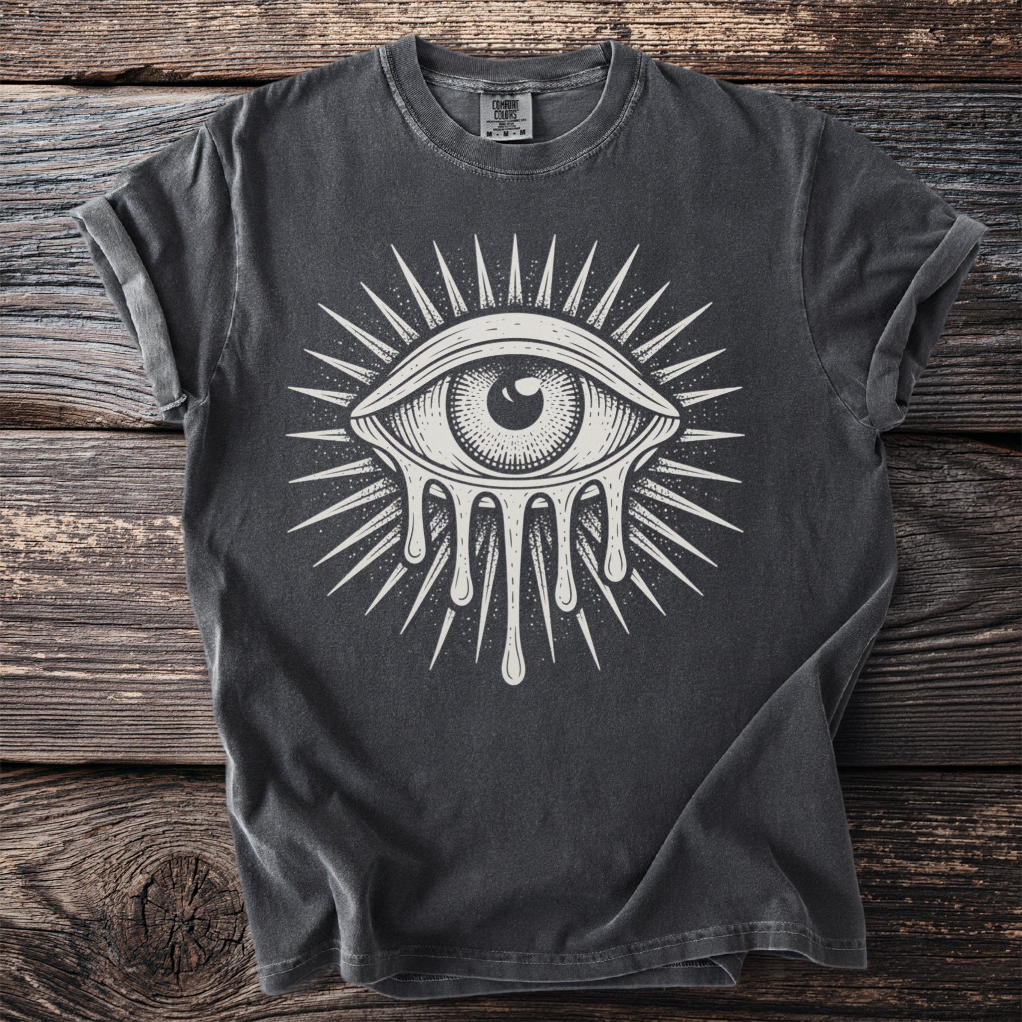 Dark gray t-shirt with a white dripping eye design and sunburst detail.