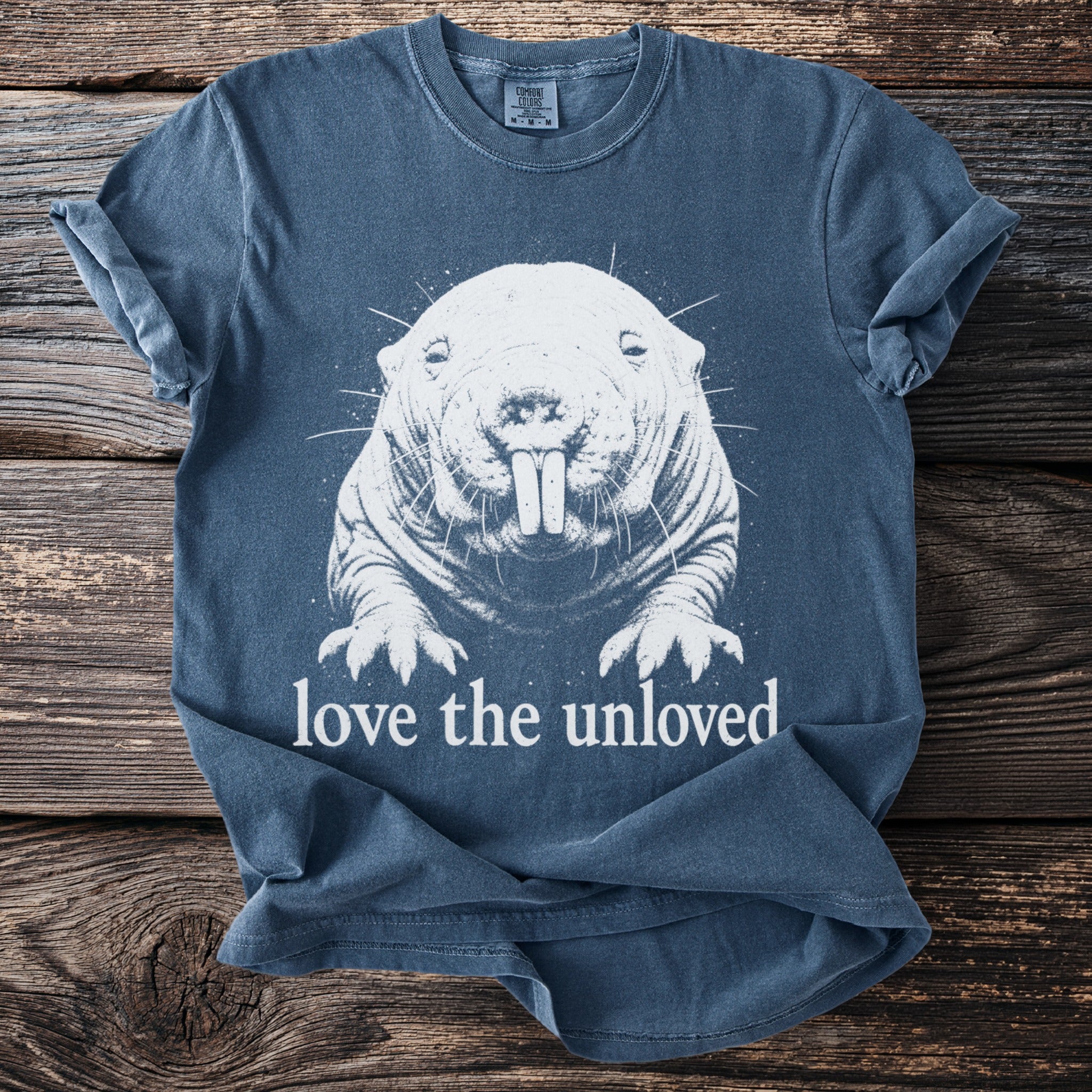 T-shirt with white drawing of a mole rat and text "love the unloved".