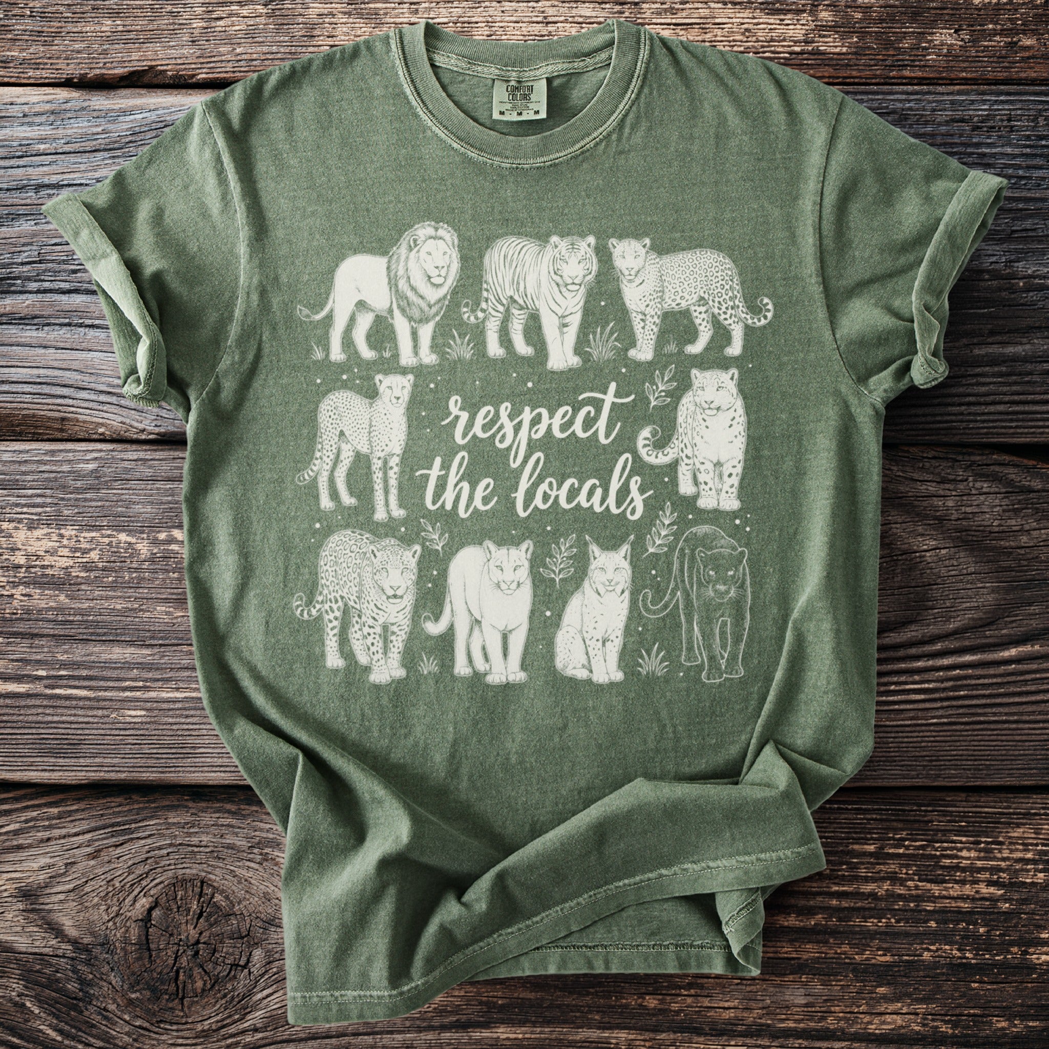 Green t-shirt with white line art of big cats and text reading "respect the locals".