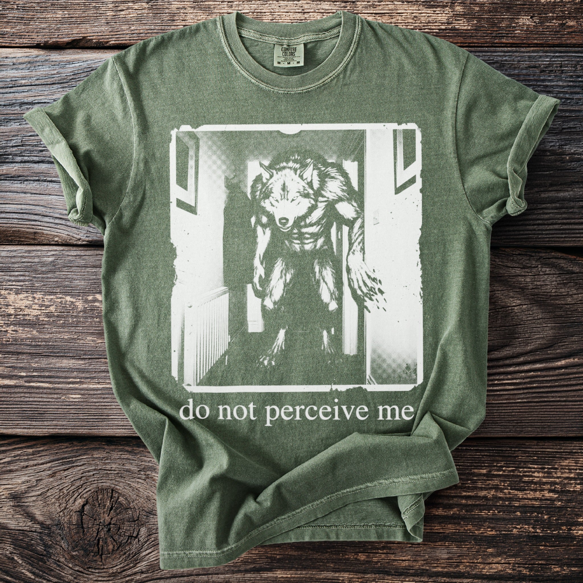 Green t-shirt with werewolf graphic and text "do not perceive me".