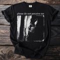 Black t-shirt with white text "please do not perceive me" and a black cat peeking.