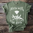 Green t-shirt with "girls will be girls" text and praying mantis graphic.