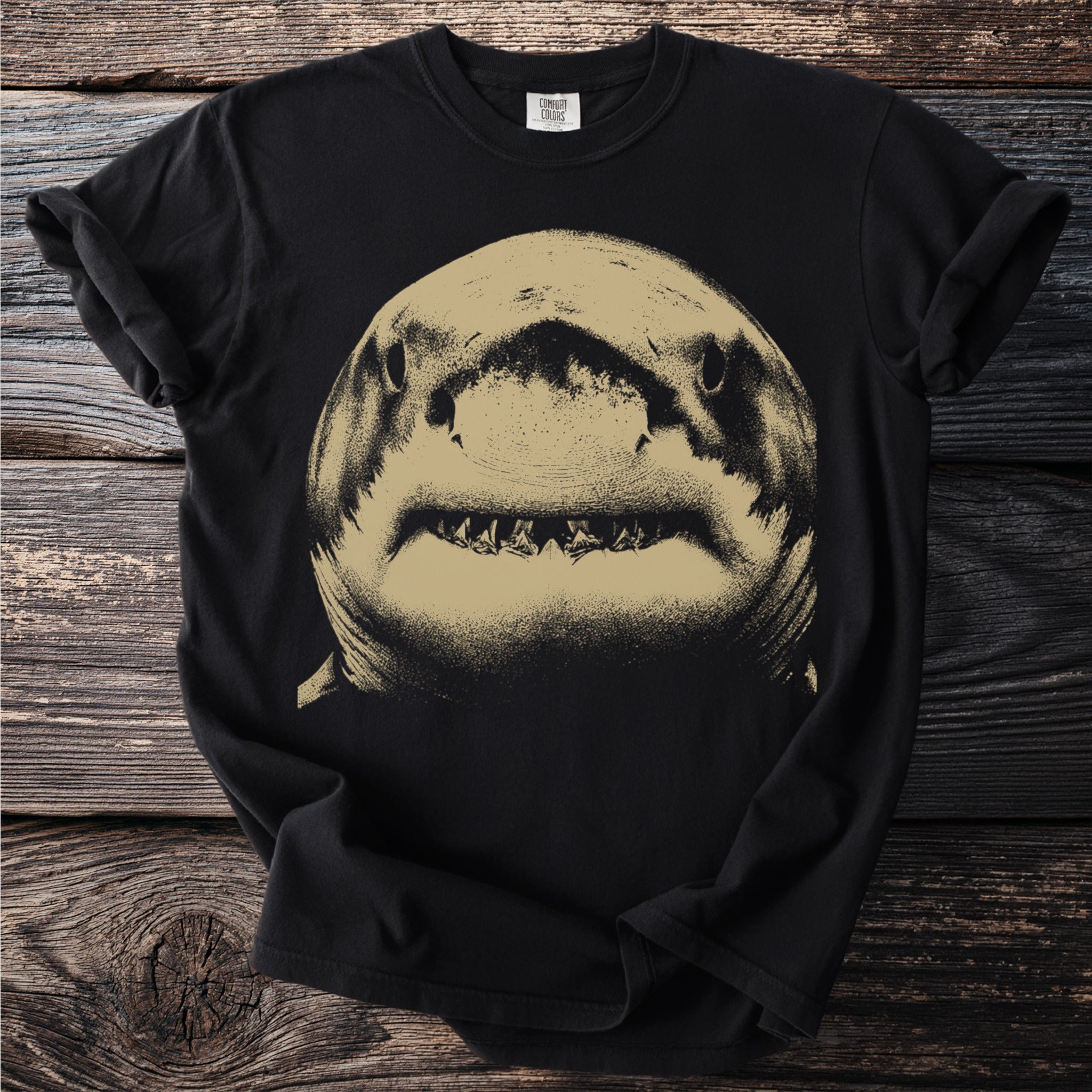 Black Comfort Colors t-shirt with a gold distressed shark face graphic.