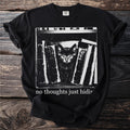 Black t-shirt with a kitten peeking from behind books with text "no thoughts just hiding".