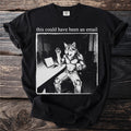 Black t-shirt with graphic of a wolf-man holding a coffee mug and waving hello.