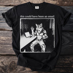 Black t-shirt with graphic of a wolf-man holding a coffee mug and waving hello.