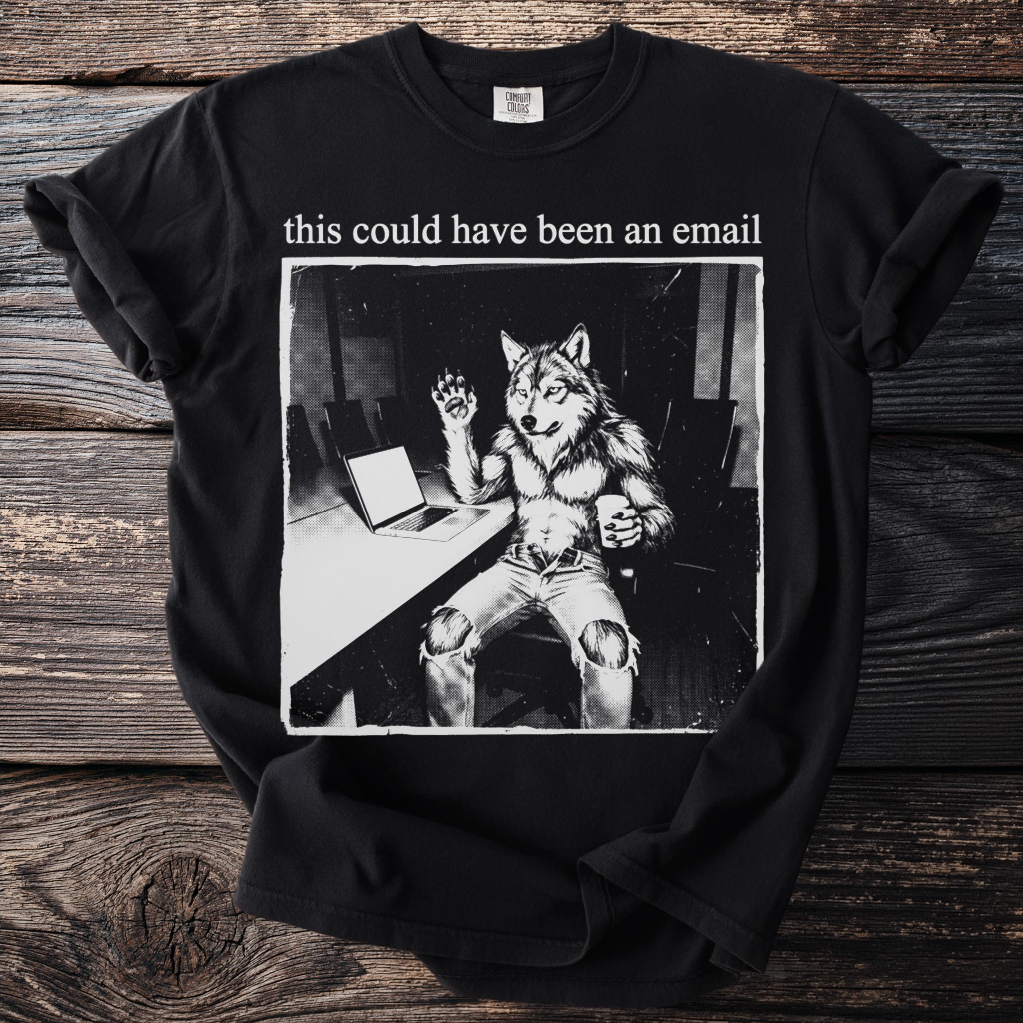 Black t-shirt with graphic of a wolf-man holding a coffee mug and waving hello.